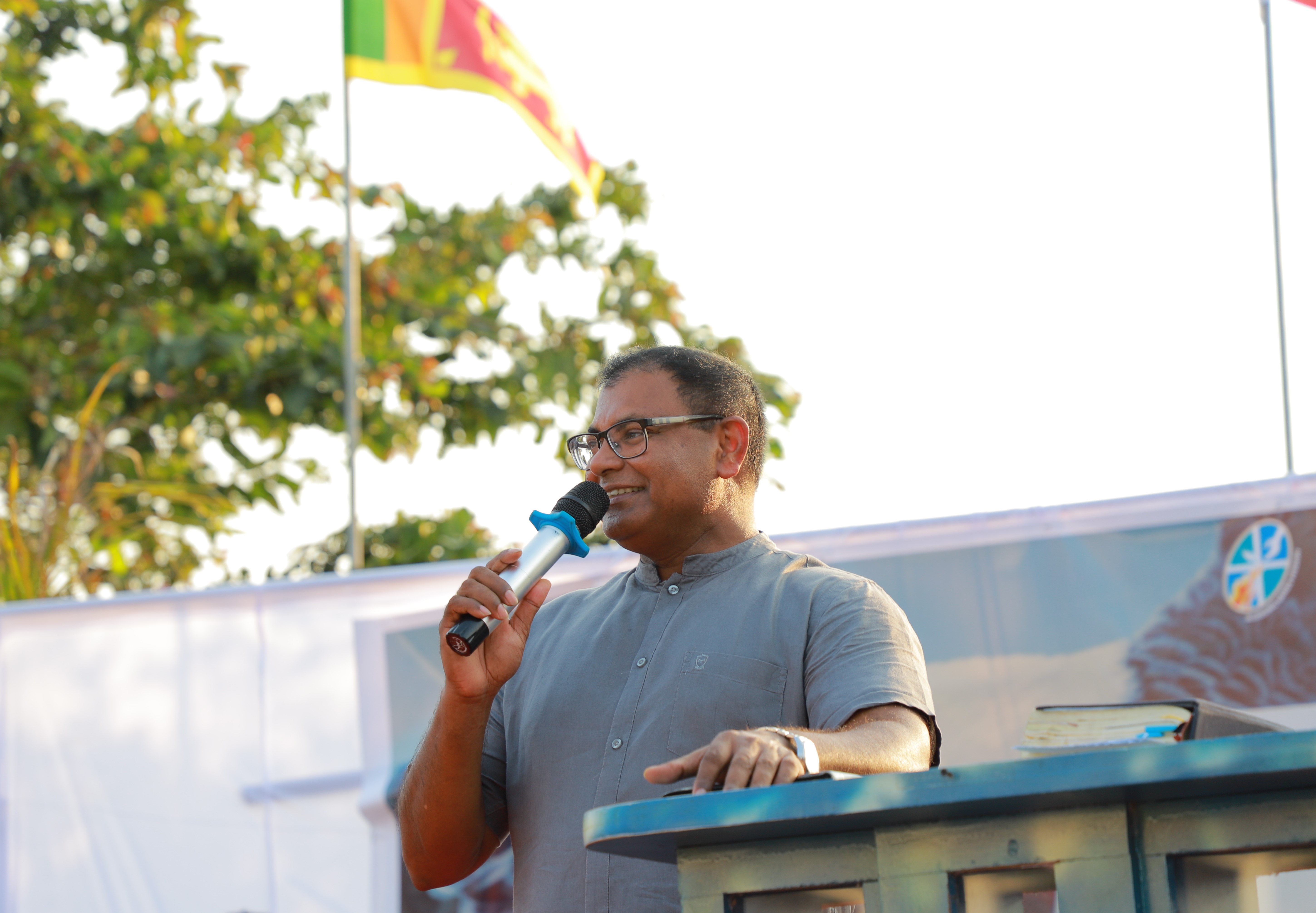A man using a microphone to speak